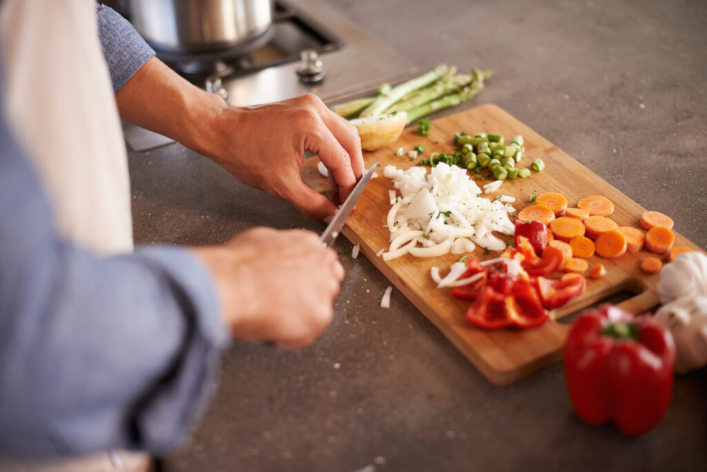 variety is the spice of life. cropped shot of a man chopping veg